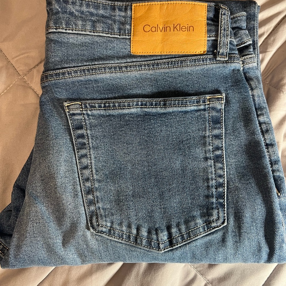 Calvin Klein Light Blue Denim Jeans with Tan Label
